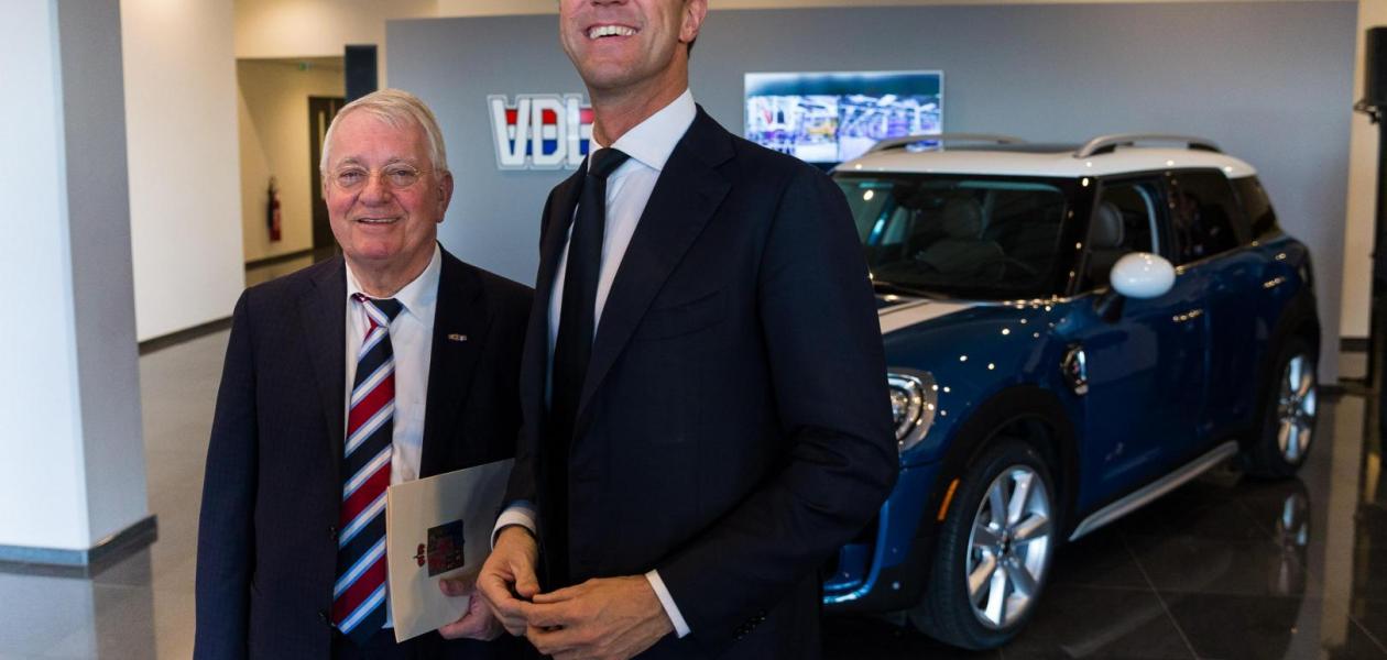 Prime Minister Mark Rutte waves the flag for the start of production of the new MINI Countryman